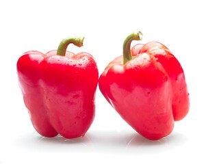  Red bell peppers on white background.