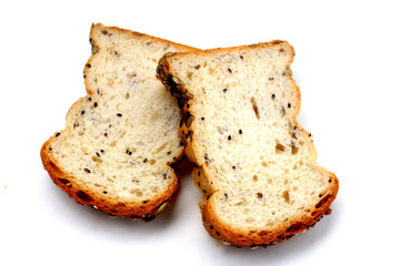 Sliced multigrain bread topped with pumpkin seeds, sunflower seeds, sesame, and black sesame.