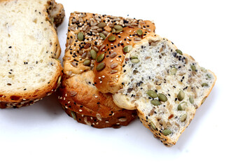 Sliced multigrain bread topped with pumpkin seeds, sunflower seeds, sesame, and black sesame.