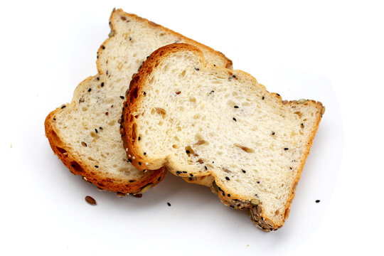 Sliced multigrain bread topped with pumpkin seeds, sunflower seeds, sesame, and black sesame.