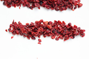 Dried cranberries piled on a white background