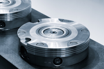 Two metal disk holders for cutting and drilling tools in a modern CNC industrial metalworking machine.