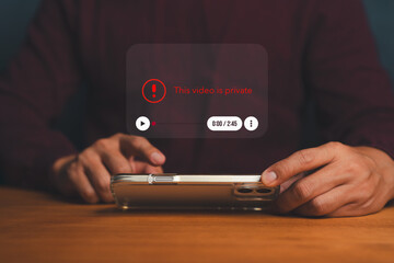 Person holding smartphone with private video notification, symbolizing digital privacy, content...