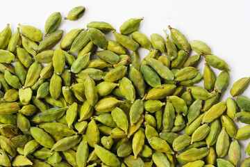 Green cardamom pods with aromatic and medicinal benefits.