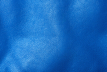 Blue genuine leather as a background macro photo.