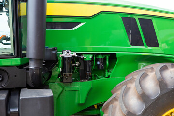 detail of a green tractor outdoors in Rio de Janeiro.