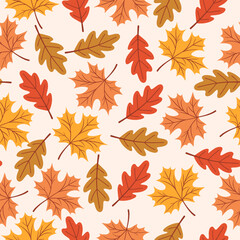 Seamless pattern with maple and oak autumn leaves. Ideal for wallpaper, gift paper, textiles, greeting cards.