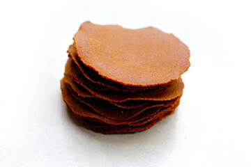 Fermented soybean discs, known as “Thua Nao,” a traditional Thai seasoning used to enhance flavor in Northern cuisine.