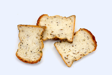 Sliced multigrain bread topped with pumpkin seeds, sunflower seeds, sesame, and black sesame.