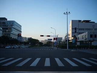 A City Intersection at Dusk with Modern Buildings and Traffic Lights