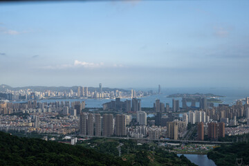 Fototapeta premium Panoramic View of the Cityscape and Bay Area with Modern High-Rise Buildings and Natural Landscapes