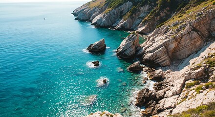Stunning Coastal View with Turquoise Waters and Rocky Shoreline.