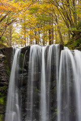 waterfall in autumn forest
