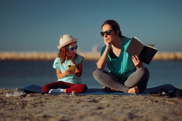 Child Using Phone While Mom Tries to read her a Story. Mom disappointing her daughter prefers...