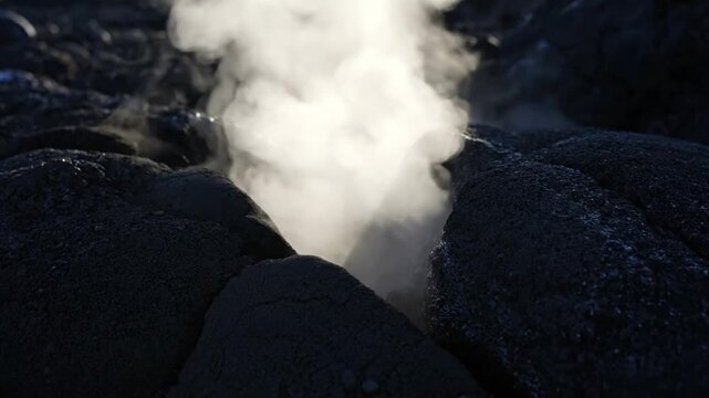 Geothermal Steam Vent Emitting Hot Vapor from Dark Volcanic Rock in an Active Volcanic Landscape