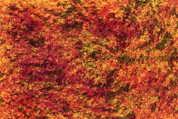 Abstract orange and brown textured background with speckled appearance