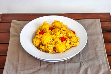 Traditional Brazilian dish of rice, chicken, and pequi (Brazilian caryocar), known as Goiana chicken stew.