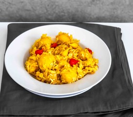 Traditional Brazilian dish of rice, chicken, and pequi (Brazilian caryocar), known as Goiana chicken stew.