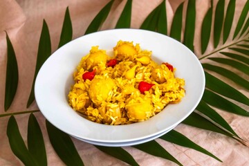 Traditional Brazilian dish of rice, chicken, and pequi (Brazilian caryocar), known as Goiana chicken stew.