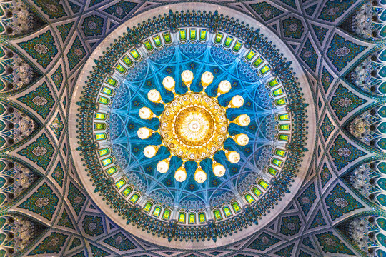 Ornate chandelier under the dome of mosque, Oman