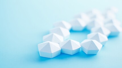 shallow. White tablets arranged in a geometric pattern on a light blue surface. STEM education sheets, lab safety posters, designed for biotech research communications, used by art directors.