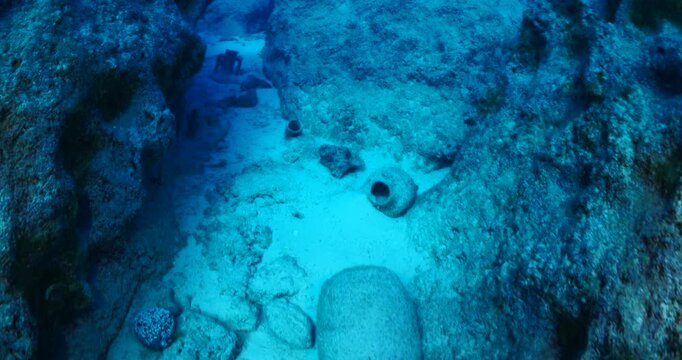 amphora field underwater ancient antic amphoras scuba divers exploring and discovering deep water