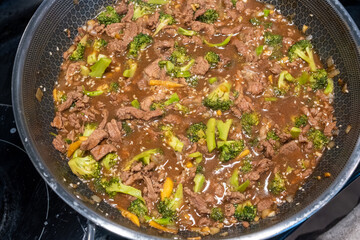 Delicious Beef and Broccoli Stir-Fry Cooking in a Pan on the Stove
