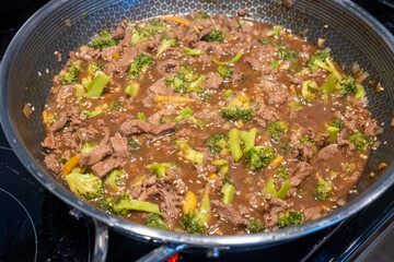 Delicious Beef and Broccoli Stir-Fry Cooking in a Pan on the Stove