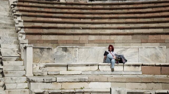 Archeology Student Working with a Tablet in the Ancient Rome Hospital Asclepieion of Pergamon