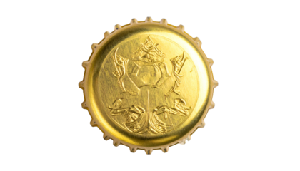Close-up of a golden bottle cap with embossed design on a stark black background