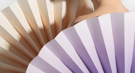 Close up of two decorative paper fans in pastel colors, one beige and one purple