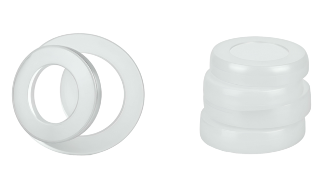 Two white objects, one set of rings and a stack of cylinders, are isolated on a black background