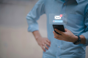 Businessman touching new message notification icon on virtual screen,email alert, online messaging system, representing digital communication, instant response, and business connectivity.
