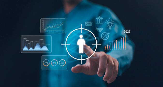 Strategic business planning and growth forecasting. Hand touches a digital screen focusing on the customer target icon amidst futuristic data analysis and investment charts for 2025 success.