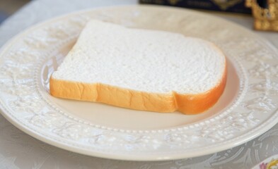 A loaf of bread prepared on a plate on the breakfast table