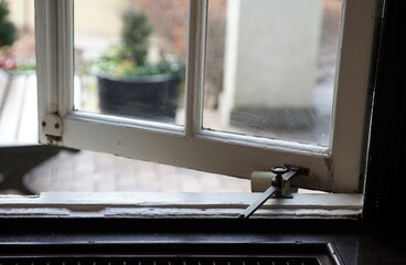 A window of an old house overlooking the garden