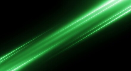 Fototapeta premium Abstract green light trails on a black background creating a dynamic effect