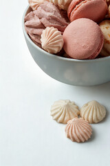 Assortment of delicate meringue cookies in a bowl