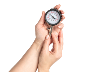 Female hands holding a tire pressure gauge showing 2 Bar, isolated on transparent background, automotive measurement tool for car tire maintenance and safety check.