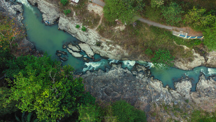 Aerial view of a scenic river flowing through lush green landscape