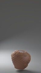 Brown sculpted clay vase on gray background with copy space
