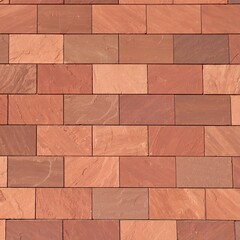 Fototapeta premium Abstract full-frame close-up of a wall of brown, terracotta-colored, and reddish rectangular bricks, showcasing their varied textures and hues in a precise, geometric pattern.