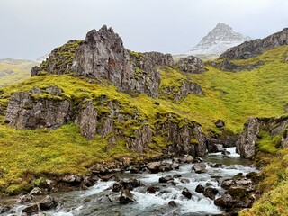 Klifbrekkufossar Waterfall in Mj&oacute;ifj&ouml;r&eth;ur, Eastfjords of Iceland, Multi-Tiered Cascades through Mossy Cliffs