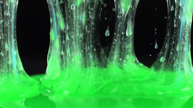 Bright green slime dripping and stretching, creating a visually appealing and textured surface