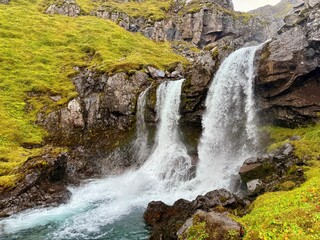 Klifbrekkufossar Waterfall in Mjóifjörður, Eastfjords of Iceland, Multi-Tiered Cascades through Mossy Cliffs