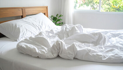 The white sheets were still messy on the bed.