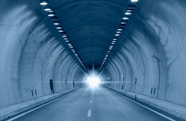 Highway road tunnel with car light