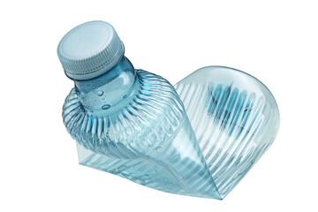 A crushed plastic water bottle on a white