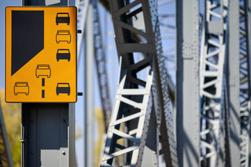 Lane End Yellow warning sign bridge infrastructure metal structure Torun Poland traffic signal