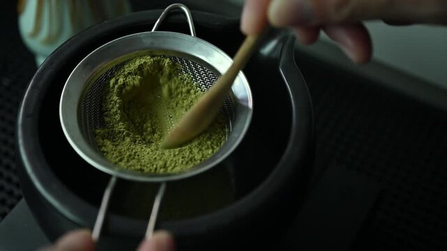 Sift Matcha powder through a sifter into a bowl to remove any clumps.